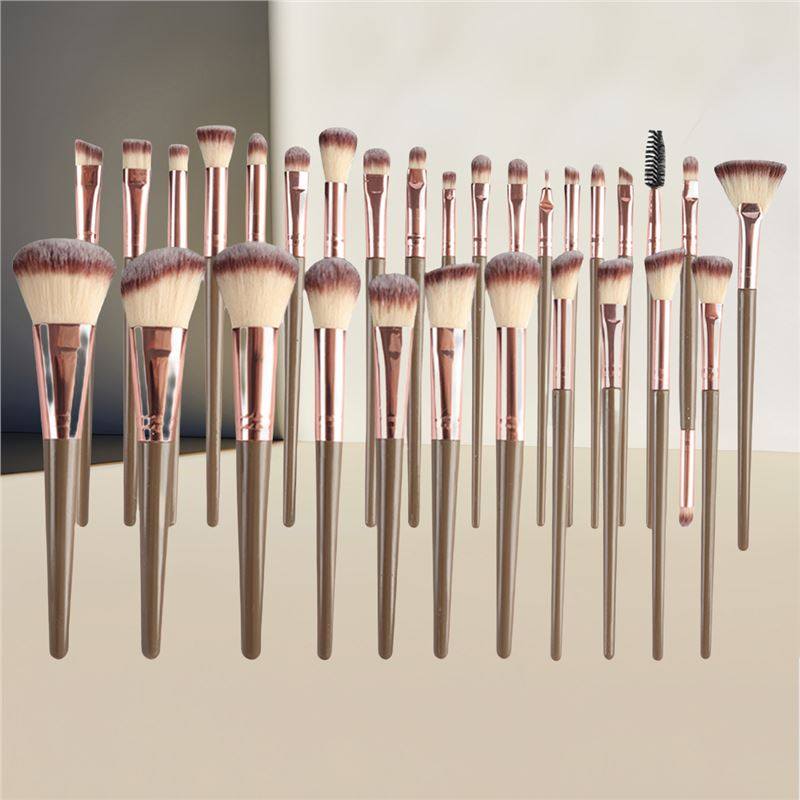 VIBE LOOP BANS Makeup brushes with rose gold handles and varied soft brown and cream synthetic bristles