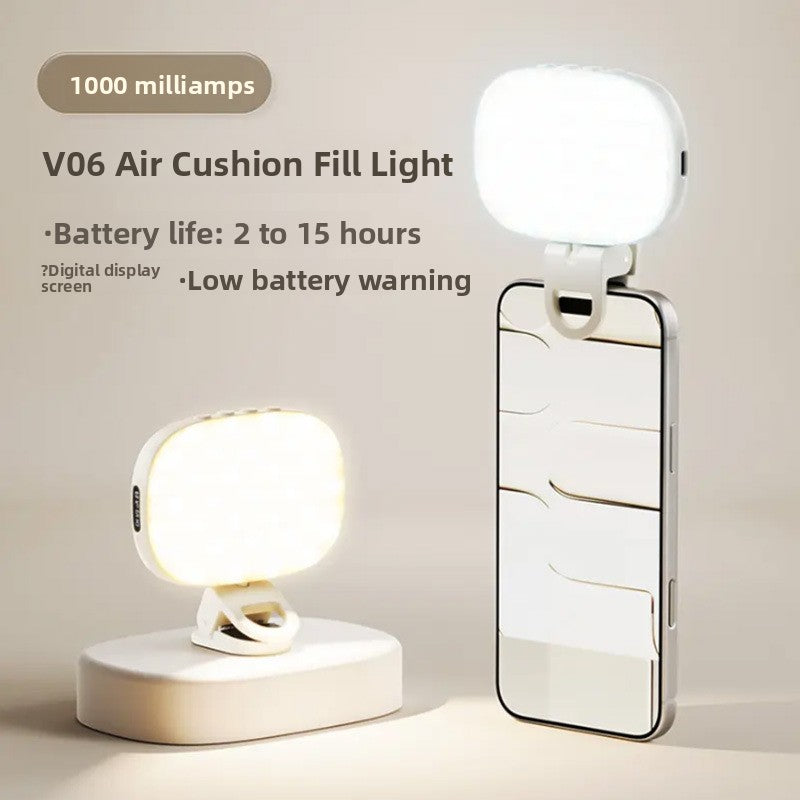 VIBE LOOP BANS phone selfie light, a compact white rounded-square LED with a digital display, shown on a phone and stand