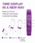 Vibration Loop Ban Alarm Watch with a purple silicone band, slim bracelet shape and glowing digital time display