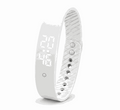Vibration Loop Ban Alarm Watch with a white silicone loop band, perforated adjustable strap, and digital display