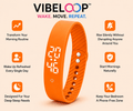 Vibration Loop Ban wrist alarm and fitness tracker in bright orange silicone, with LED display and perforated adjustable strap
