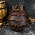 Backpack in dark brown Vintage Genuine Leather with a rounded beetle-inspired shape, layered curved panels and contrast stitching