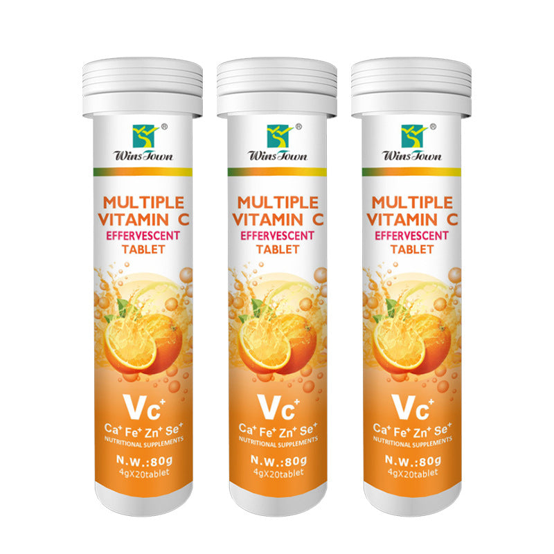 Vitamin C Tablets in three white plastic tubes with orange citrus graphics and effervescent tablet labels.