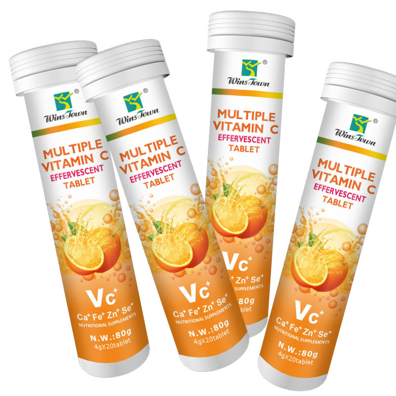 Vitamin C Tablets in white tubes with orange citrus graphics, multivitamin effervescent labels, and silver screw caps
