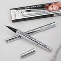 Waterproof Liquid Eyeliner Pen with a fine black felt tip and reflective silver barrel, shown with matching cap and box