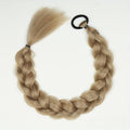 Wig with braids in long honey-blonde synthetic hair, featuring a thick plaited ponytail and black elastic loop