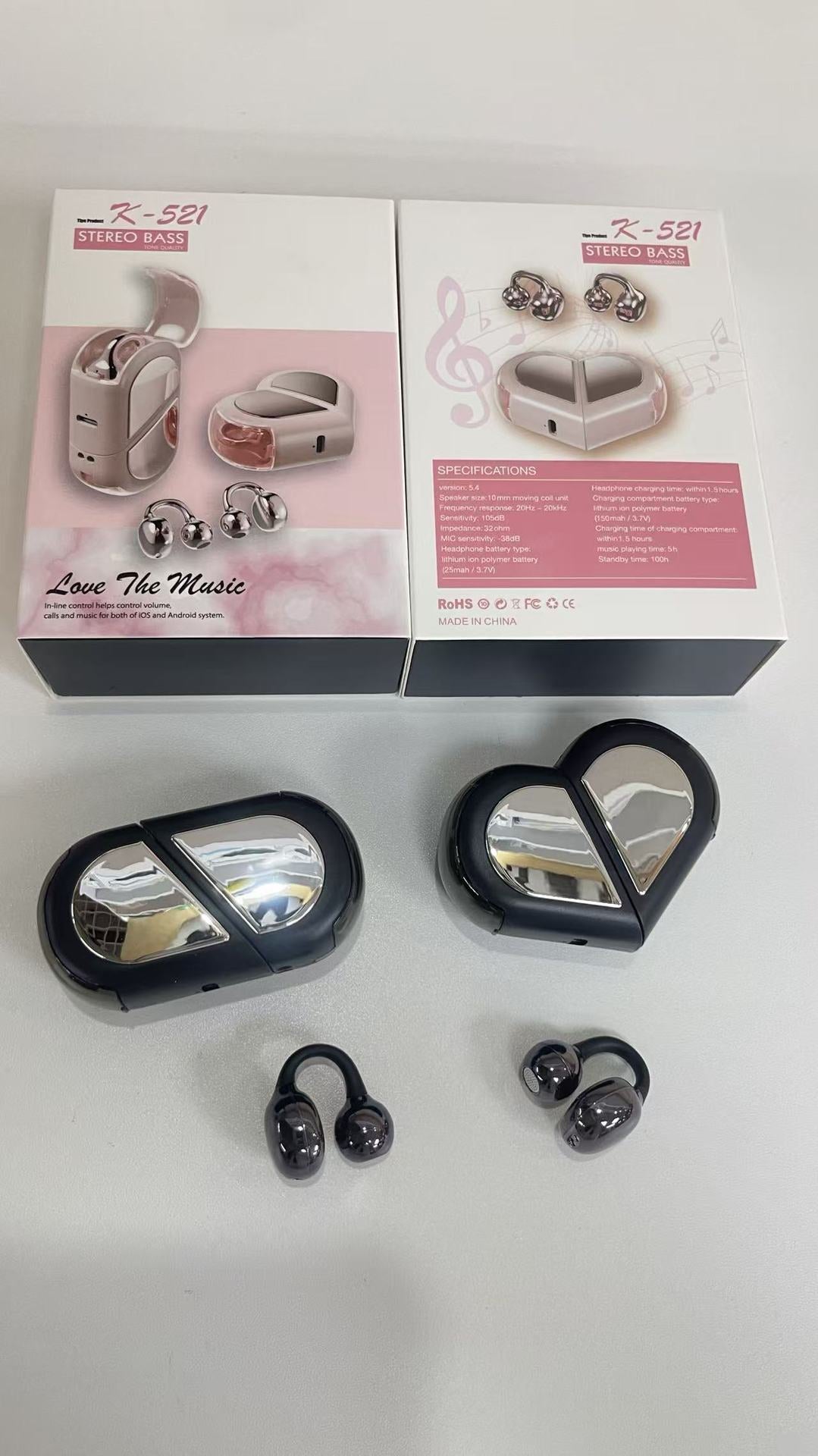 Wireless Gaming Bluetooth Earphones with glossy black and silver earbuds and heart-shaped charging cases, shown with pink retail packaging