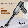 Wireless Handheld Vacuum Cleaner in black and dark gray, with a clear dust chamber, pleated filter and brush nozzle.