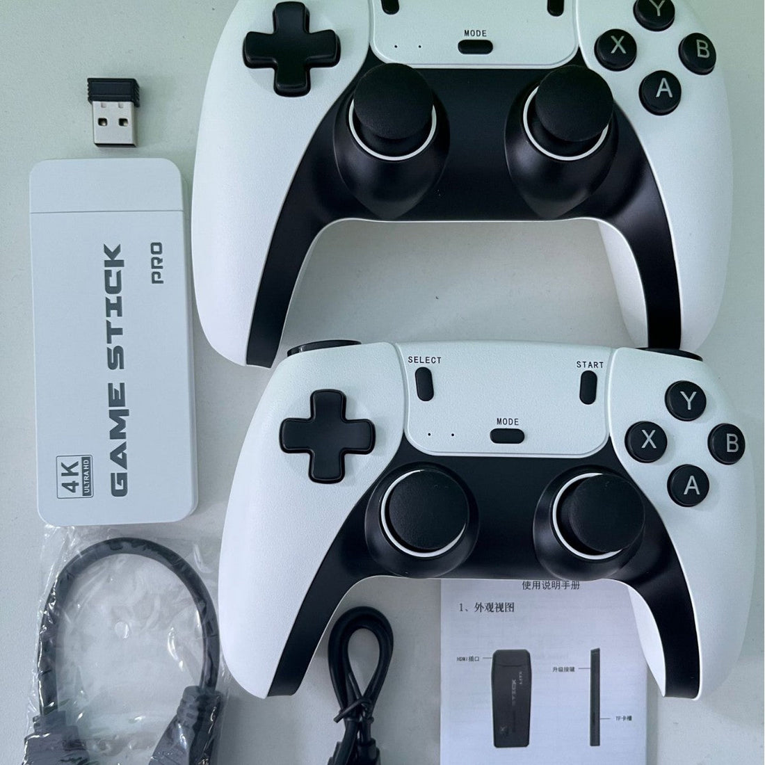 Wireless HDMI TV Game Console set with black and white plastic controllers, tactile buttons and blue-and-white packaging.
